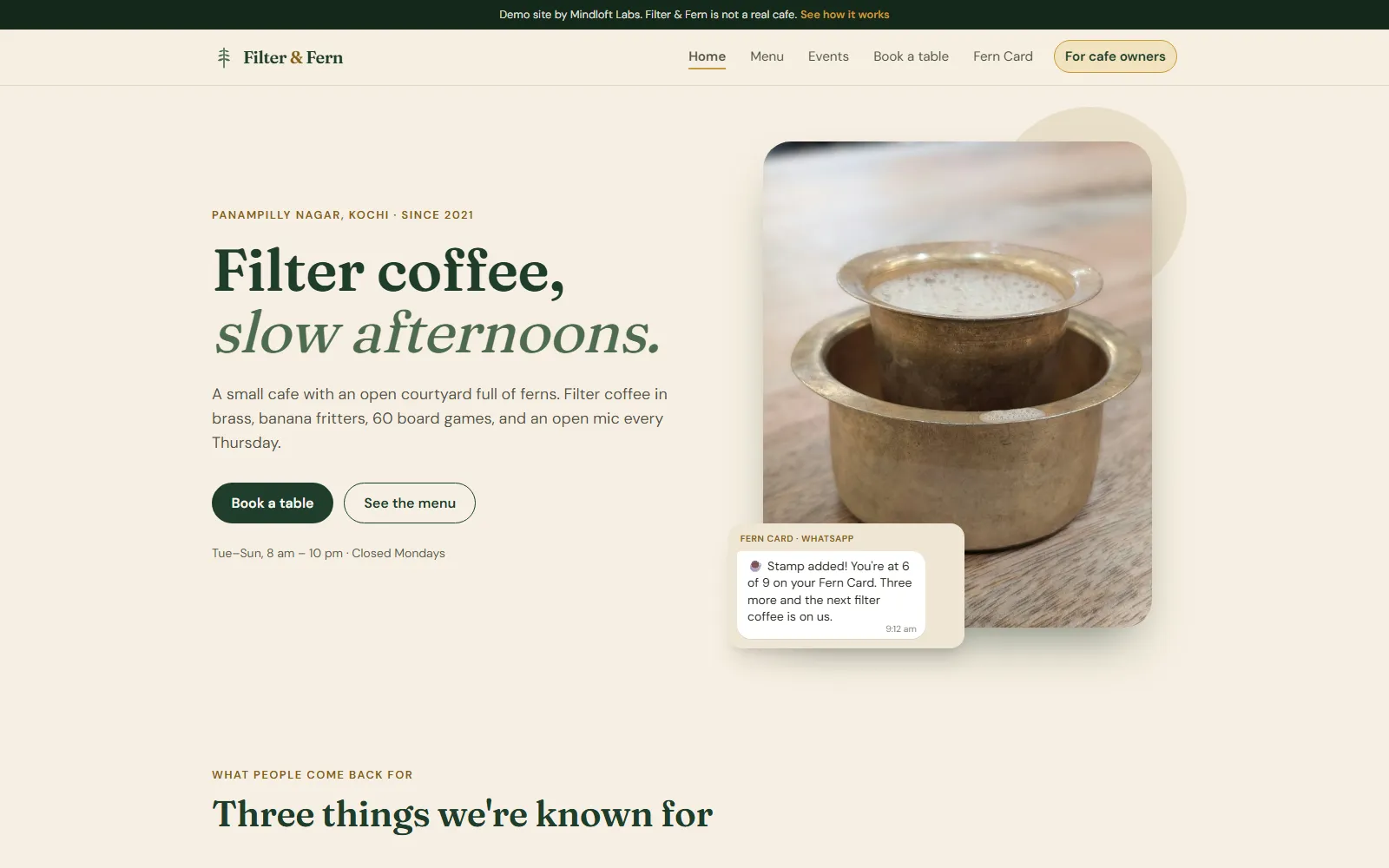 The home page of the Filter & Fern demo site, with the heading "Filter coffee, slow afternoons.", a brass filter coffee tumbler and a WhatsApp loyalty card message.